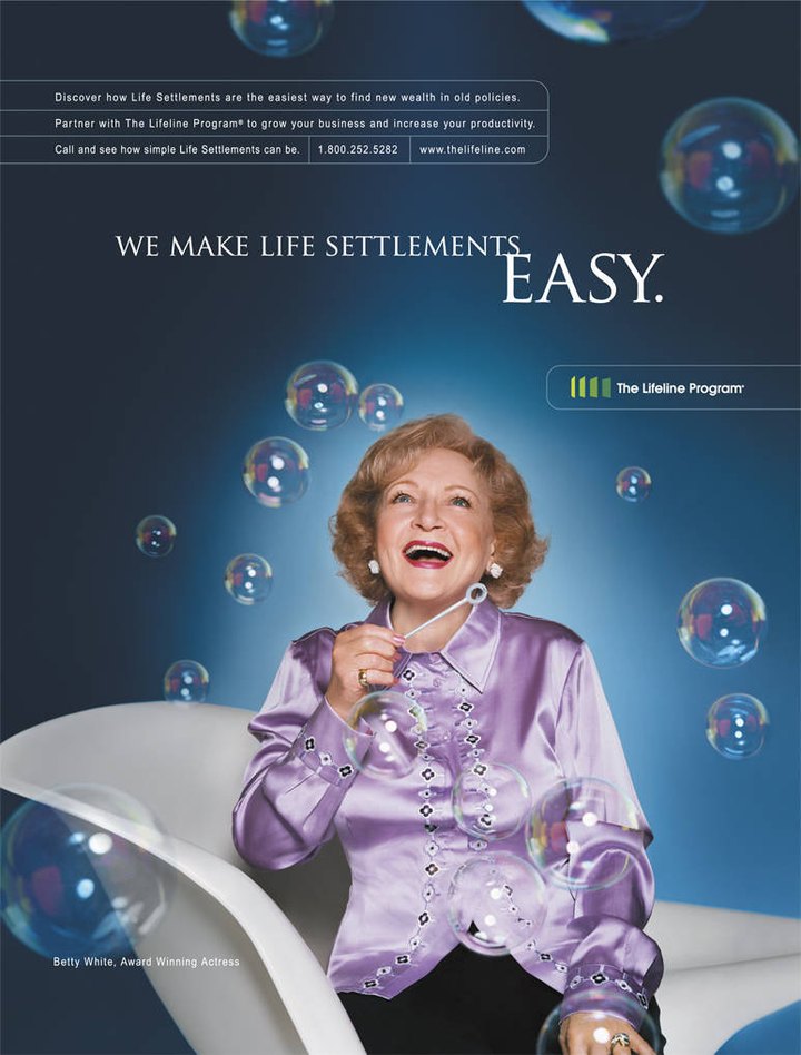 The Lifeline Program trade advertisement — Betty White blowing bubbles: 'We make life settlements easy.'