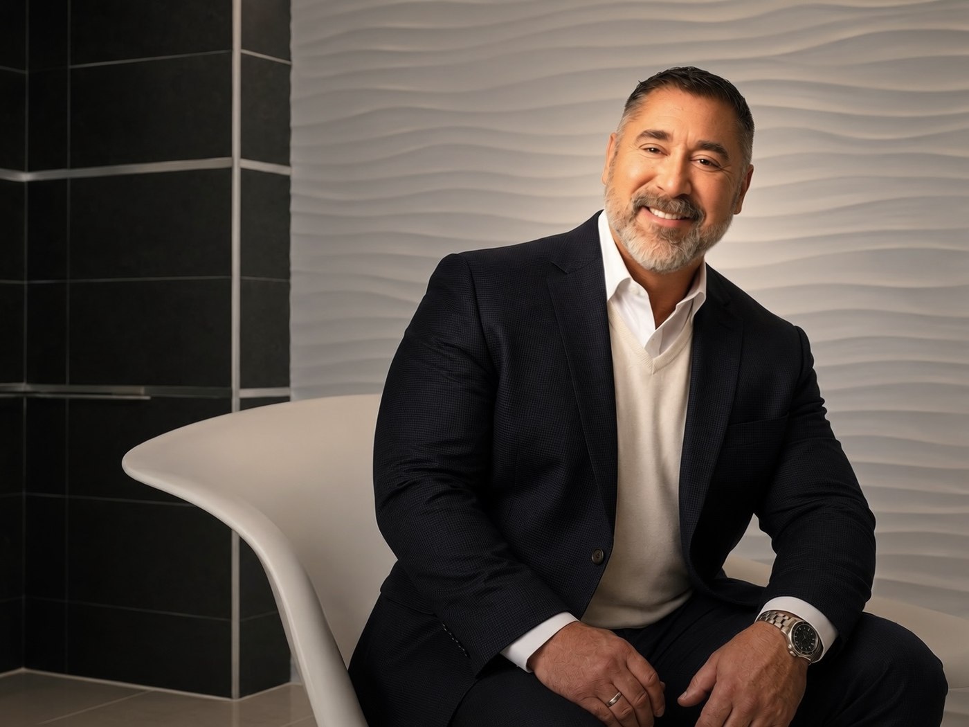 Stephen E. Terrell seated in the white chair from the Betty White 'Life is Easy. Blow Bubbles.' campaign shoot